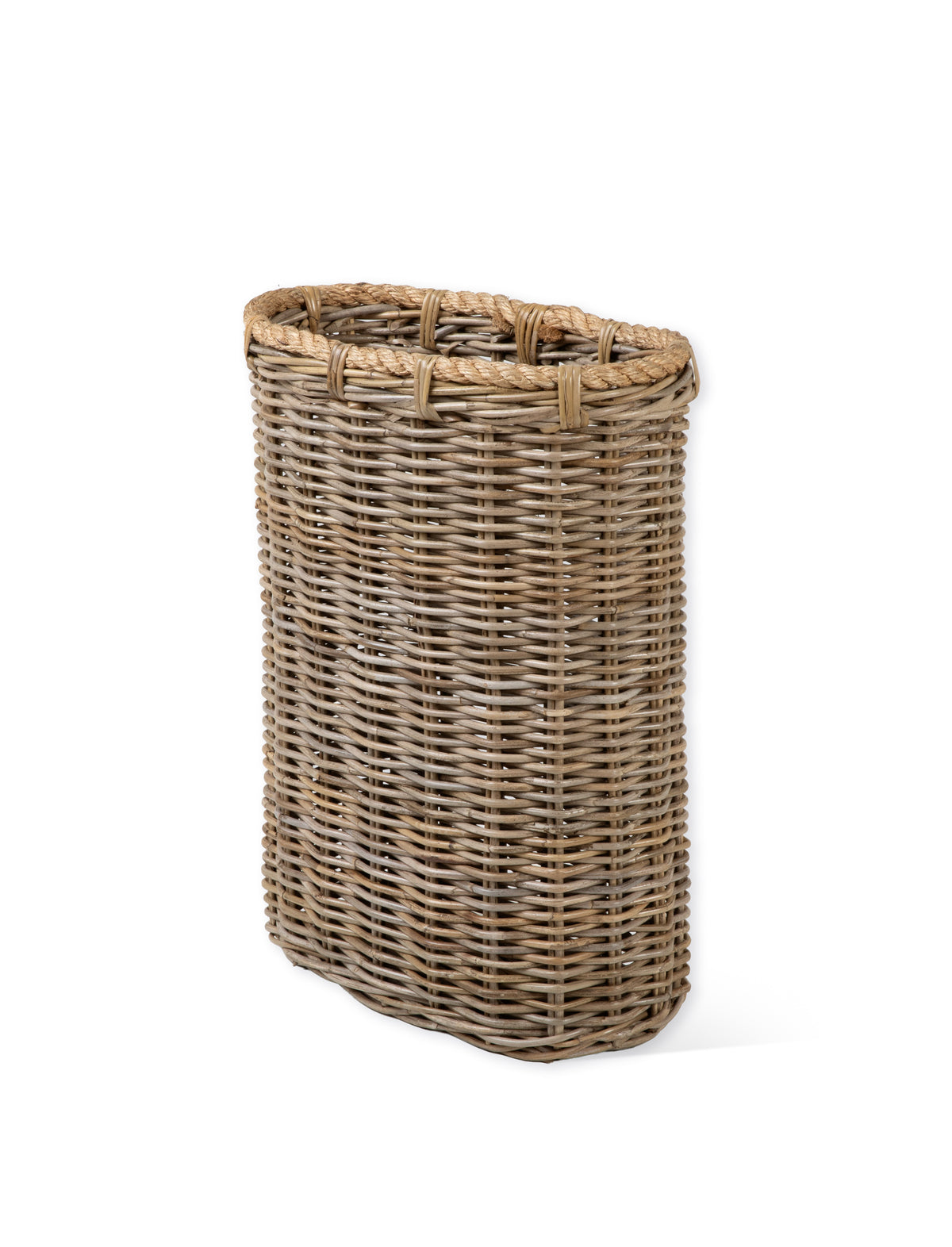 A natural woven wicker basket with a rounded rectangular shape and a thick woven rim, shown on a plain white background.